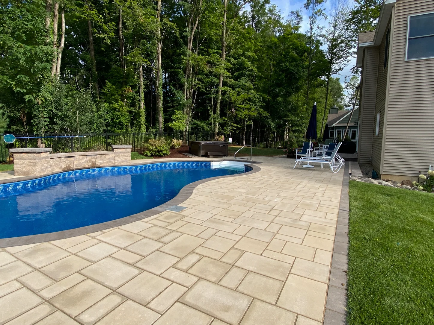 After: completed fiberglass pool installation by Bollman Landscape