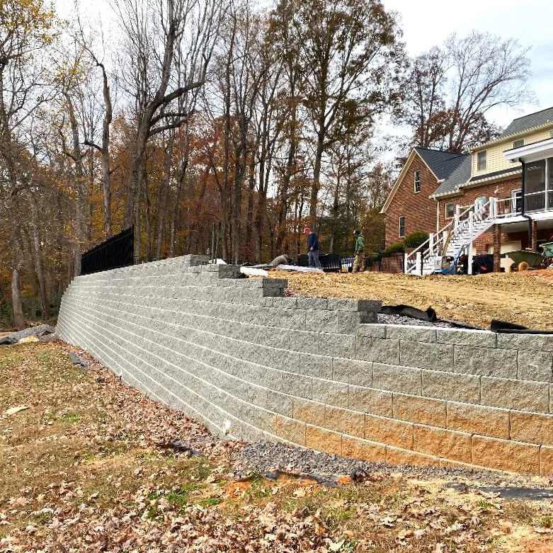 Retaining wall construction restoring property stability